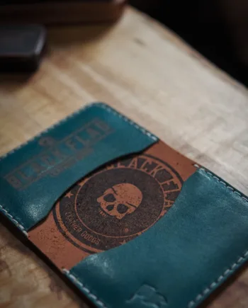 Close up of stamp on leather minimalist bifold cardholder