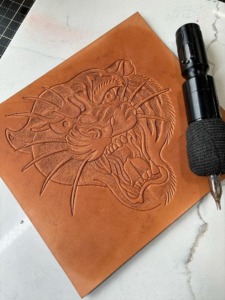 Leather tooling done by 21 Grams Leather Goods using The Leather Tattoo Machine 