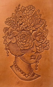 Leather tooling done by 21 Grams Leather Goods using The Leather Tattoo Machine 