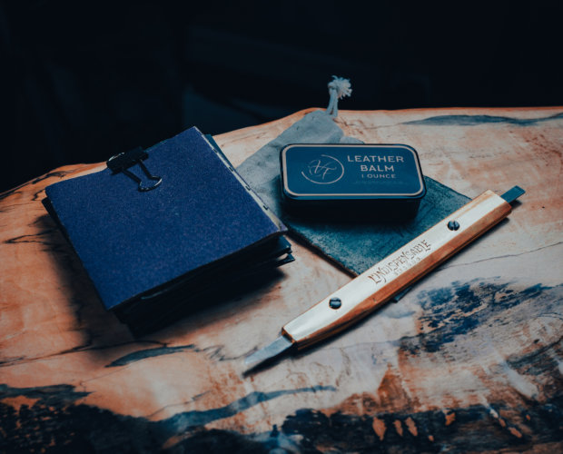 Sand paper, leather balm and a leather knife